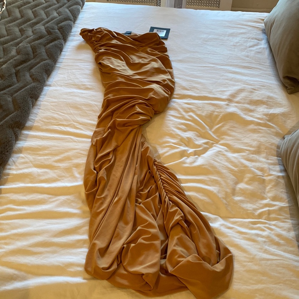 Norma kamali dress. Never worn. Tags still on. Beige nude color. Size medium.